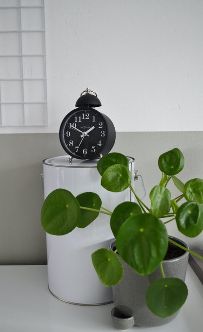 NeXtime Clocks metal alarm clock with a 16 cm single bell design and loud alarm sound, suitable for bedside use.