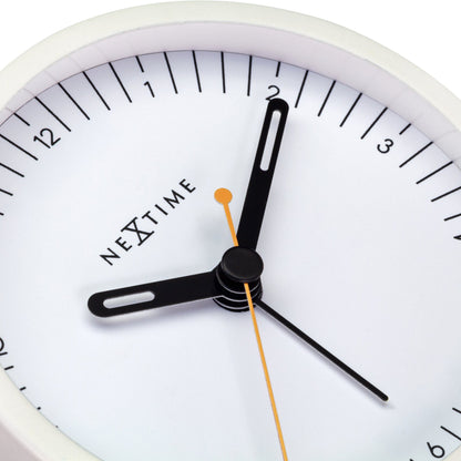 Small NeXtime metal table alarm clock with light function, silent operation, measuring 9x9x7.5cm, detailed view of clock face.