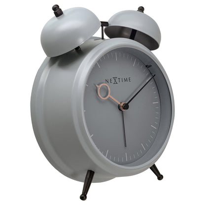 NeXtime Golden Hour metal alarm clock showing a sleek design with light function, silent operation, and dimensions 15x18x7cm.