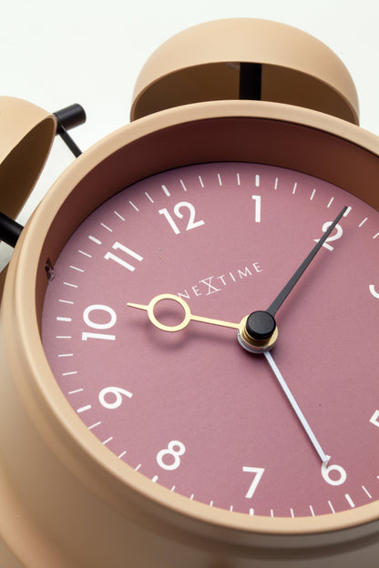 NeXtime Golden Hour metal alarm clock, 12x14x6cm, with a sleek design and gold finish, displaying the clock face with hands and numbers.