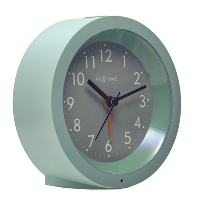 NeXtime Circle alarm clock with silent light dial, 10.5cm x 3.6cm, showing a sleek round design on the left side.