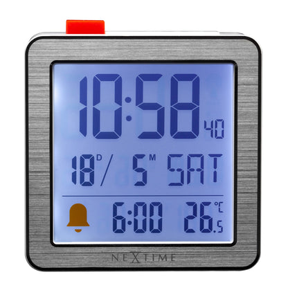NeXtime Mini digital table alarm clock with metal and ABS construction, front view showing digital display and compact design