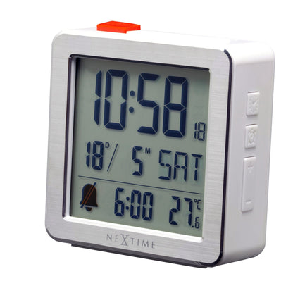NeXtime Mini digital table alarm clock with metal and ABS construction, compact 6x6.4x2.1cm, displayed from the right side.