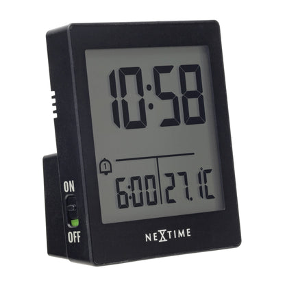 Left side view of NeXtime digital table alarm clock with compact size, black and white design, and "Wake Up" display.