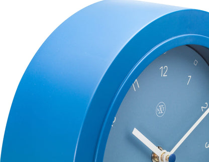 NeXtime Swing Table Clock in black plastic, 30x20 cm, showing a close-up of the modern design and clock face.
