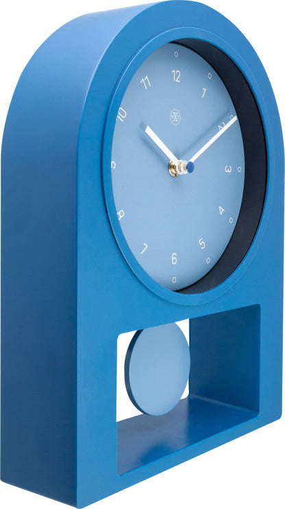 NeXtime Swing Table Clock, 30x20cm plastic clock with a modern design, shown from the left side.