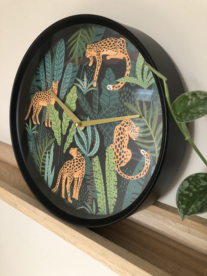 NeXtime Clocks Urban Jungle wall clock, 30cm plastic design with jungle-inspired pattern, suitable for modern home decor.