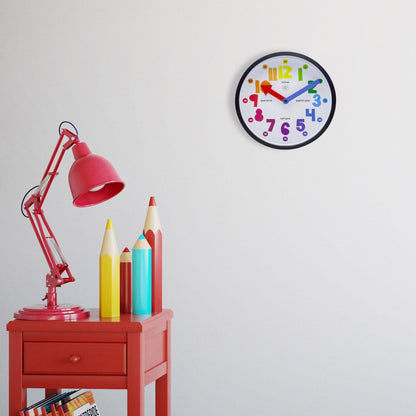 NeXtime Clocks Sophia wall clock, 26 cm plastic clock with a modern design, black hour and minute hands on a white face.