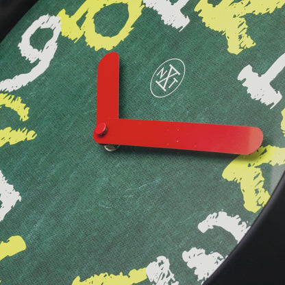 Green NeXtime wall clock, 30cm silent plastic clock with chalkboard surface and modern design, detailed view.