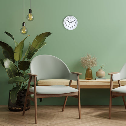 NeXtime Clocks wall clock, 25.5cm silent plastic clock with a robust design, shown hanging on an interior wall.