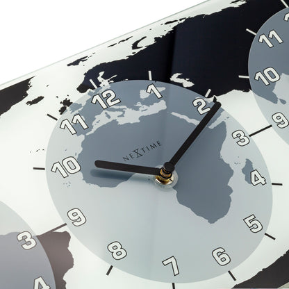 NeXtime Clocks wall clock with glass face, 50x18.6x3.6 cm, world time design named 'Mondial' showing multiple time zones.