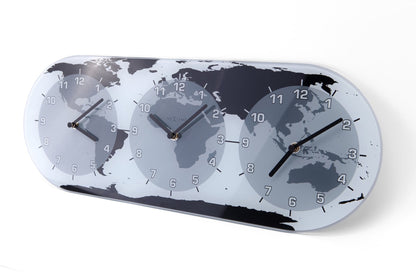 NeXtime Clocks Mondial glass wall clock with world time zones, measuring 50 x 18.6 x 3.6 cm, shown from the right side.