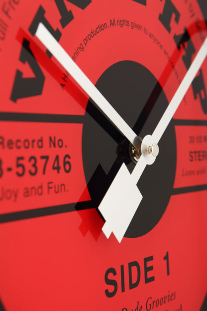 NeXtime Clocks vinyl-themed wall clock with 43cm glass face featuring a stylish vinyl record design.