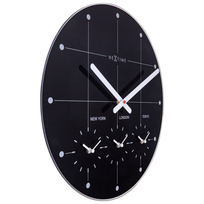 NeXtime Clocks 43cm silent wall clock with glass face, featuring a "Big City" design, shown from the left side.