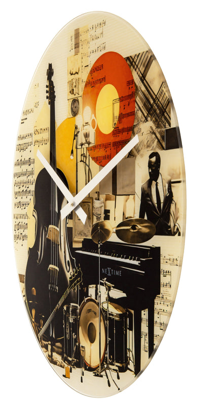 NeXtime Blues wall clock with a 43cm glass face, silent movement, and multicolour design on the right side.