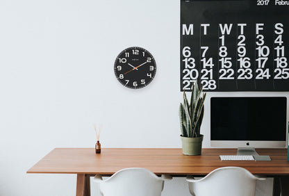 NeXtime Clocks Classy Round wall clock with glass face, 30 x 3.5 cm, featuring a sleek, modern design.