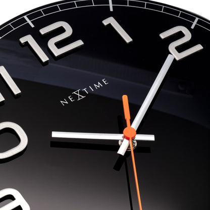 Close-up of NeXtime Clocks' Classy Round wall clock with a glass face, 30 x 3.5 cm, featuring a sleek, modern design.