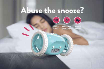 Blue NeXtime Clocks Clocky Alarm Clock on wheels, featuring a modern design and digital display, set on a blue background.