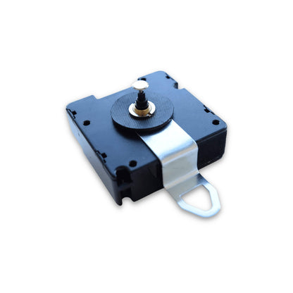 NeXtime Clocks radio controlled movement (PMBL120RP) showing a close-up of the precise movement mechanism.